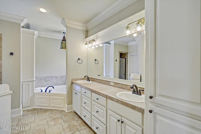 full bathroom featuring ornamental molding, a sink, and a garden tub