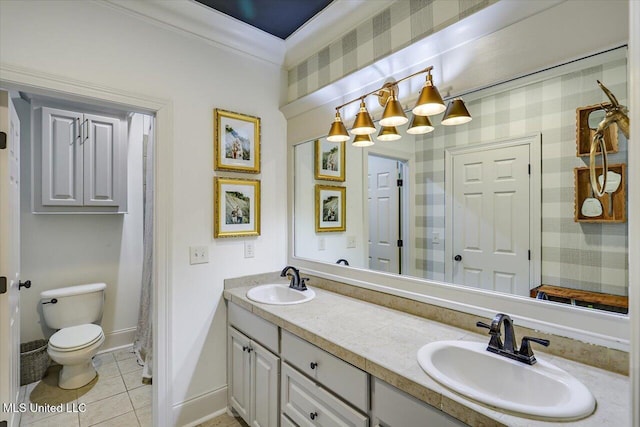 full bathroom featuring a sink, tile patterned floors, toilet, and double vanity