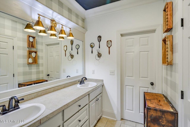 bathroom with a sink, tile patterned flooring, double vanity, and crown molding