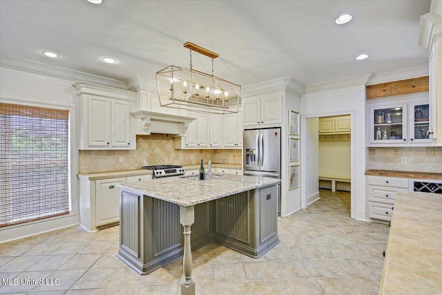 kitchen with a sink, decorative backsplash, recessed lighting, and white cabinetry