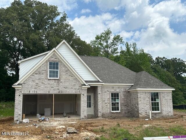 7668 Ridgefield Dr, Horn Lake, MS 38637 - view of front of home featuring brick siding and a garage