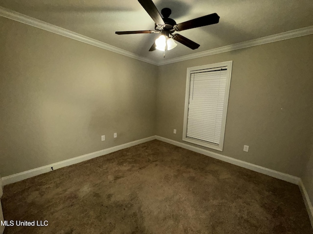 unfurnished room featuring ornamental molding, ceiling fan, and dark carpet