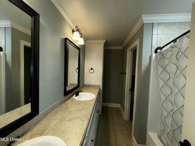 bathroom with tile patterned flooring, crown molding, vanity, and a textured ceiling