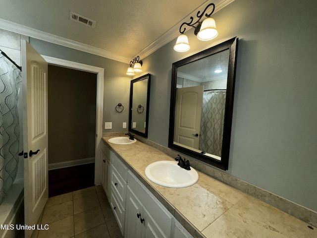 bathroom featuring vanity, tile patterned flooring, and ornamental molding