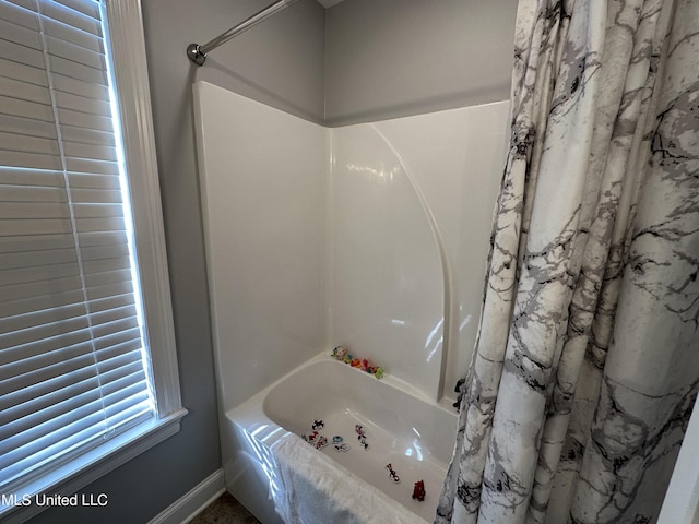 bathroom featuring shower / tub combo