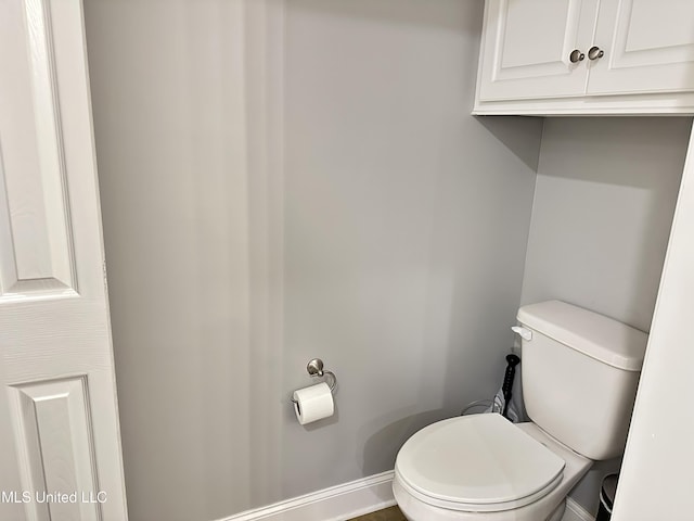 bathroom featuring toilet