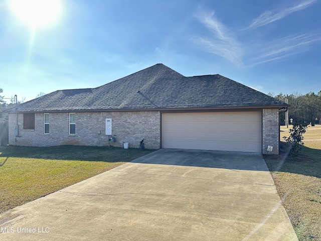 view of property exterior with a garage and a lawn