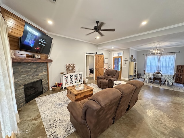 living room with a barn door, crown molding, a stone fireplace, and ceiling fan with notable chandelier