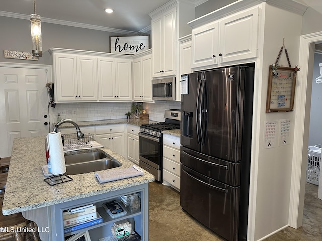 kitchen featuring appliances with stainless steel finishes, backsplash, a kitchen island with sink, sink, and white cabinetry