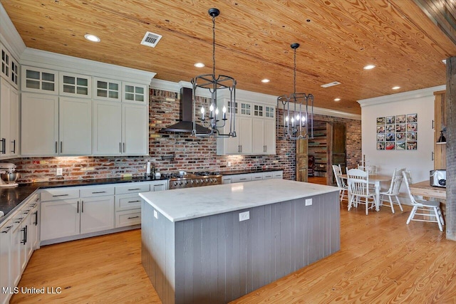 849 Athens Rd, Mendenhall, MS 39114 - kitchen with ventilation hood, light wood-style floors, a chandelier, wood ceiling, and a kitchen island