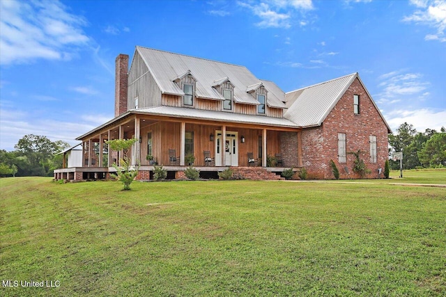 849 Athens Rd, Mendenhall, MS 39114 - view of front facade with a chimney, a porch, a front lawn, a metal roof, and board and batten siding