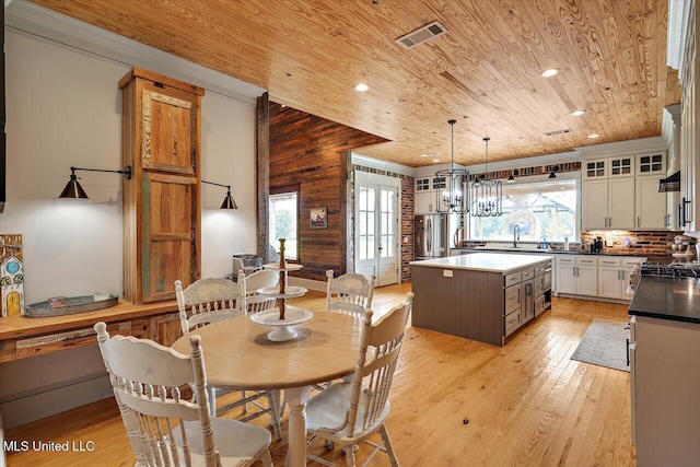 849 Athens Rd, Mendenhall, MS 39114 - dining space featuring wooden ceiling, plenty of natural light, light wood-type flooring, wooden walls, and recessed lighting