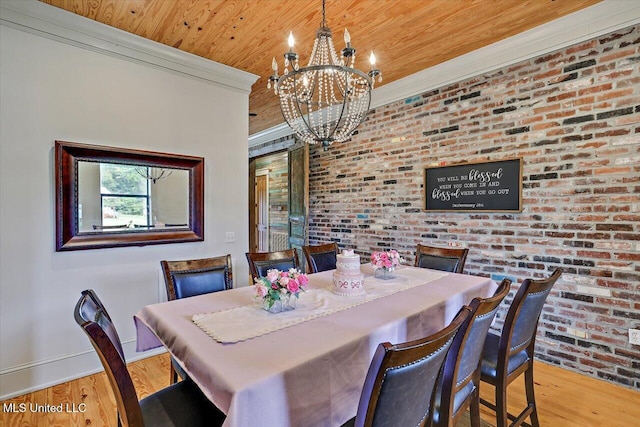 849 Athens Rd, Mendenhall, MS 39114 - dining area with wood ceiling, wood finished floors, a chandelier, brick wall, and crown molding
