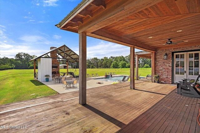 849 Athens Rd, Mendenhall, MS 39114 - wooden terrace with ceiling fan, a yard, an outdoor pool, and french doors