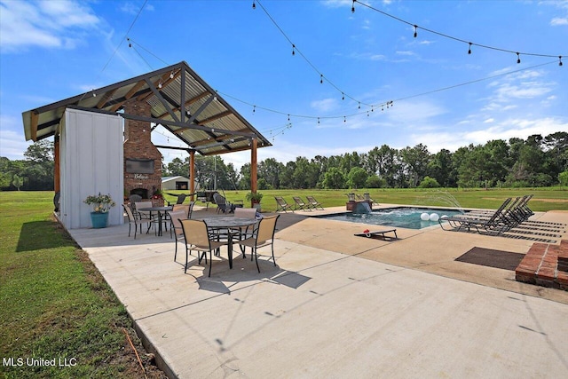 849 Athens Rd, Mendenhall, MS 39114 - view of patio / terrace with a gazebo, an outdoor fireplace, an outdoor pool, and view of wooded area