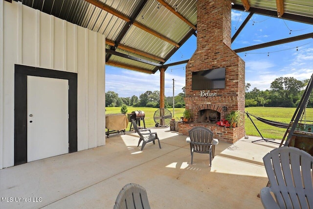 849 Athens Rd, Mendenhall, MS 39114 - view of patio / terrace with an outdoor brick fireplace and view of scattered trees