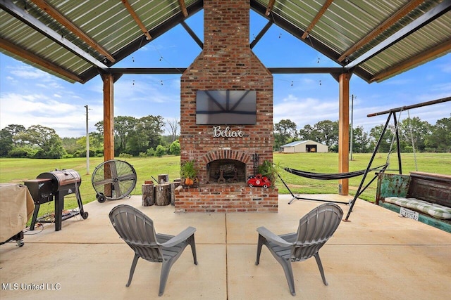 849 Athens Rd, Mendenhall, MS 39114 - view of patio featuring an outdoor brick fireplace and view of scattered trees