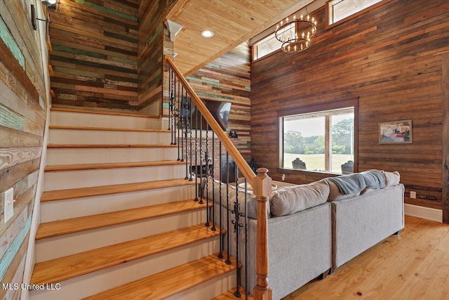 849 Athens Rd, Mendenhall, MS 39114 - staircase with wooden walls, a chandelier, wood finished floors, wood ceiling, and recessed lighting