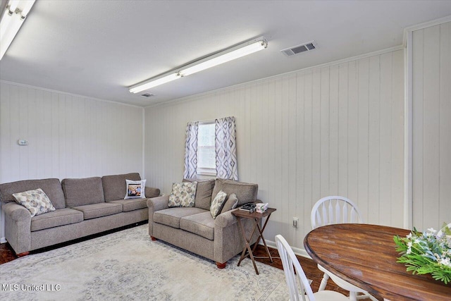 849 Athens Rd, Mendenhall, MS 39114 - living room with wood finished floors, wood walls, and crown molding
