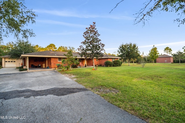 ranch-style house with a front lawn and a garage