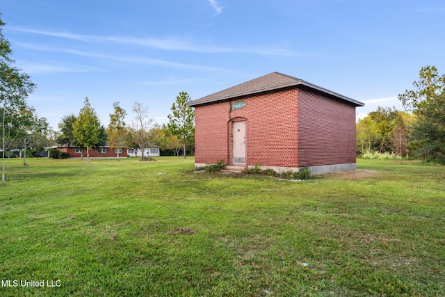 view of outbuilding with a lawn