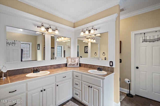 bathroom with crown molding, a sink, and double vanity