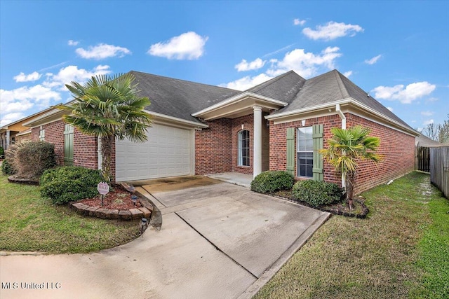 view of front of home with a garage, concrete driveway, brick siding, and a front lawn