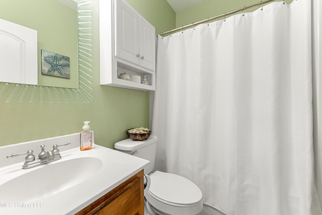 bathroom with vanity, toilet, and a shower with curtain