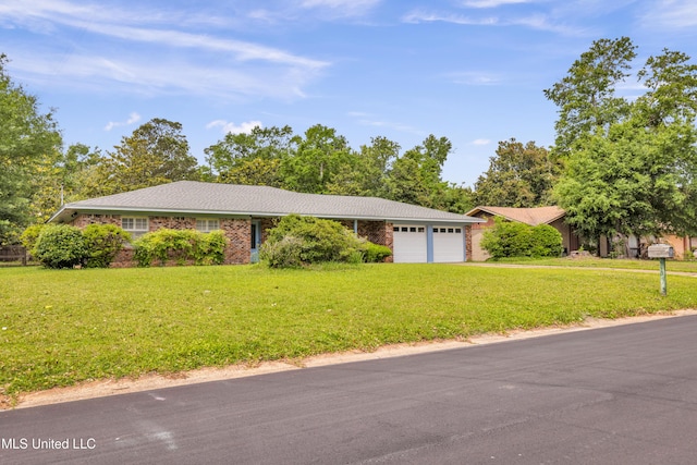 ranch-style home featuring an attached garage, brick siding, and a front lawn
