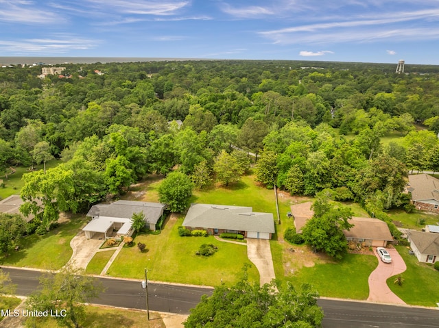 birds eye view of property with a forest view and a residential view