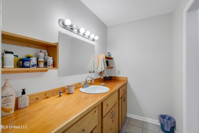 bathroom with tile patterned flooring and vanity