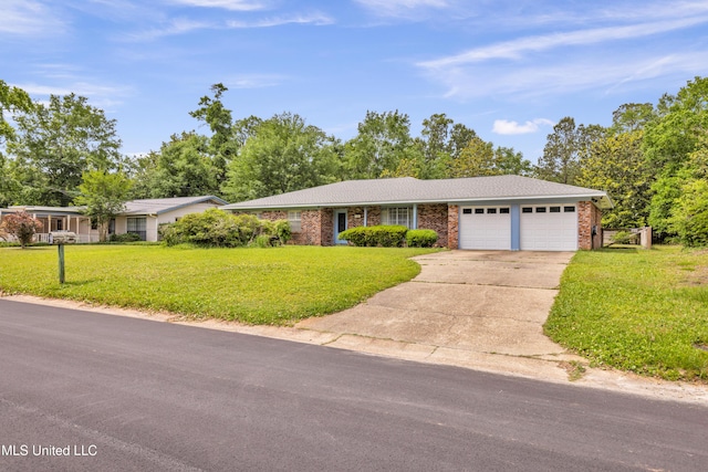 ranch-style home featuring concrete driveway, a garage, brick siding, and a front yard