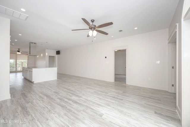 unfurnished living room featuring light hardwood / wood-style flooring and ceiling fan