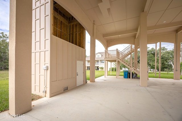 view of home's community featuring stairs and a yard