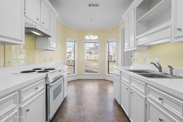 kitchen with white cabinetry, hanging light fixtures, white appliances, and sink