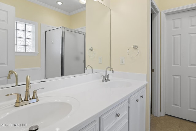 bathroom with crown molding, vanity, tile patterned floors, and walk in shower