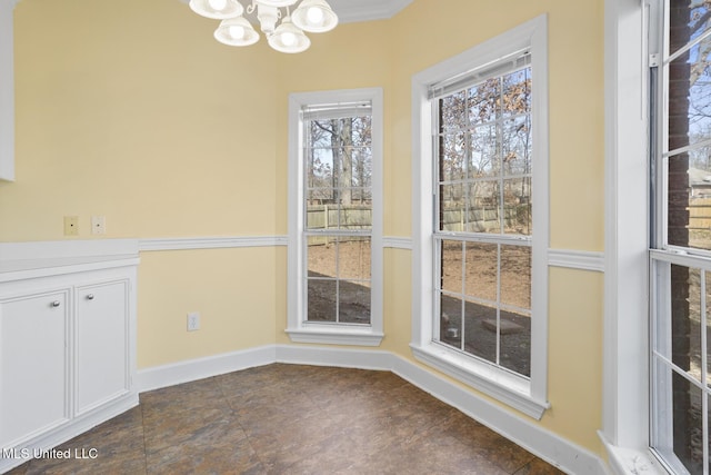 unfurnished dining area with a chandelier