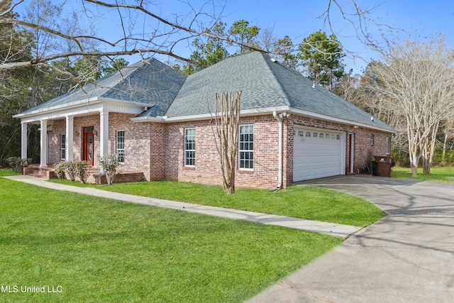 view of front of property with a garage, a front lawn, roof with shingles, and brick siding