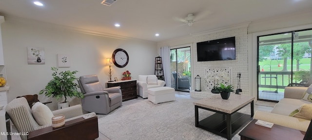 417 Highpoint Dr, Diamondhead, MS 39525 - living room with crown molding, a fireplace, a ceiling fan, and recessed lighting