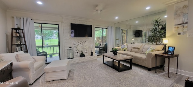 417 Highpoint Dr, Diamondhead, MS 39525 - living area featuring ornamental molding, healthy amount of natural light, baseboards, a fireplace, and recessed lighting