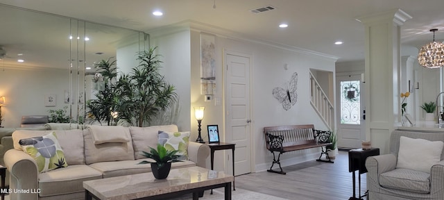 417 Highpoint Dr, Diamondhead, MS 39525 - living room featuring light wood-type flooring, stairs, crown molding, recessed lighting, and baseboards