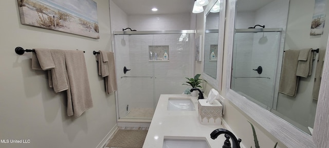 417 Highpoint Dr, Diamondhead, MS 39525 - bathroom with a shower stall, double vanity, baseboards, and recessed lighting