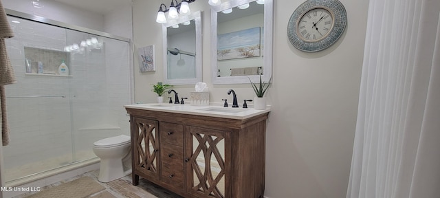 417 Highpoint Dr, Diamondhead, MS 39525 - bathroom with toilet, a stall shower, and double vanity