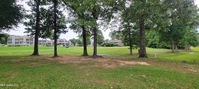 417 Highpoint Dr, Diamondhead, MS 39525 - view of green lawn featuring a residential view
