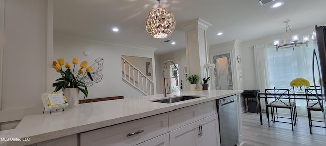 417 Highpoint Dr, Diamondhead, MS 39525 - kitchen with a chandelier, a sink, stainless steel dishwasher, ornamental molding, and light wood-style flooring