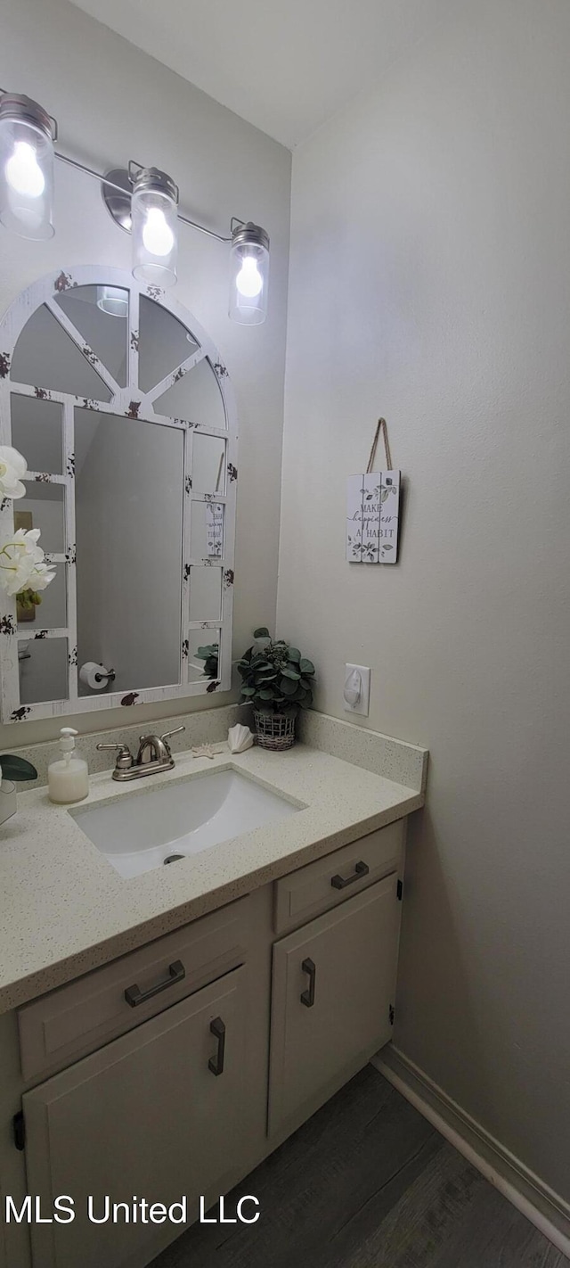 417 Highpoint Dr, Diamondhead, MS 39525 - bathroom featuring vanity and wood finished floors