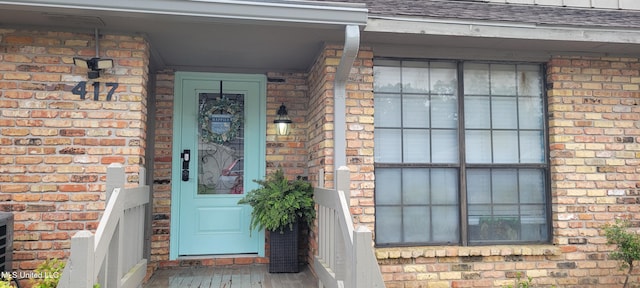 417 Highpoint Dr, Diamondhead, MS 39525 - property entrance with brick siding and roof with shingles