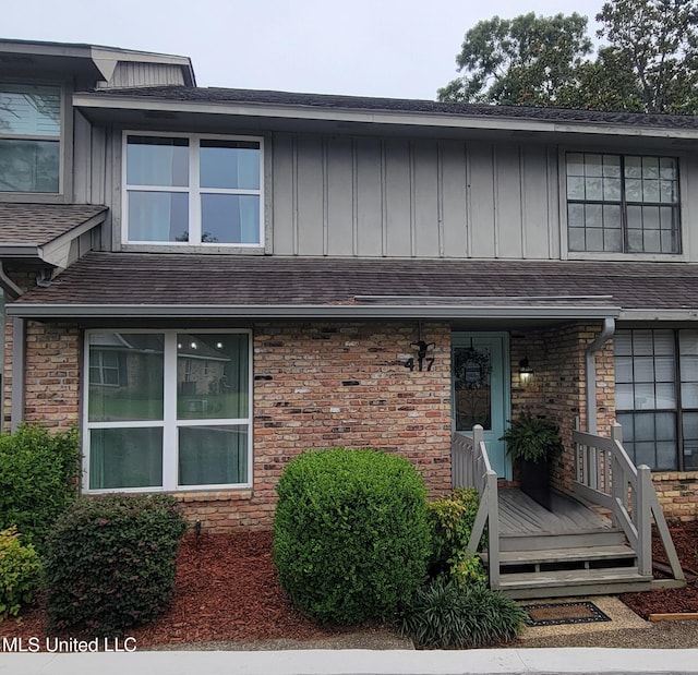 417 Highpoint Dr, Diamondhead, MS 39525 - view of front of house with board and batten siding and a shingled roof