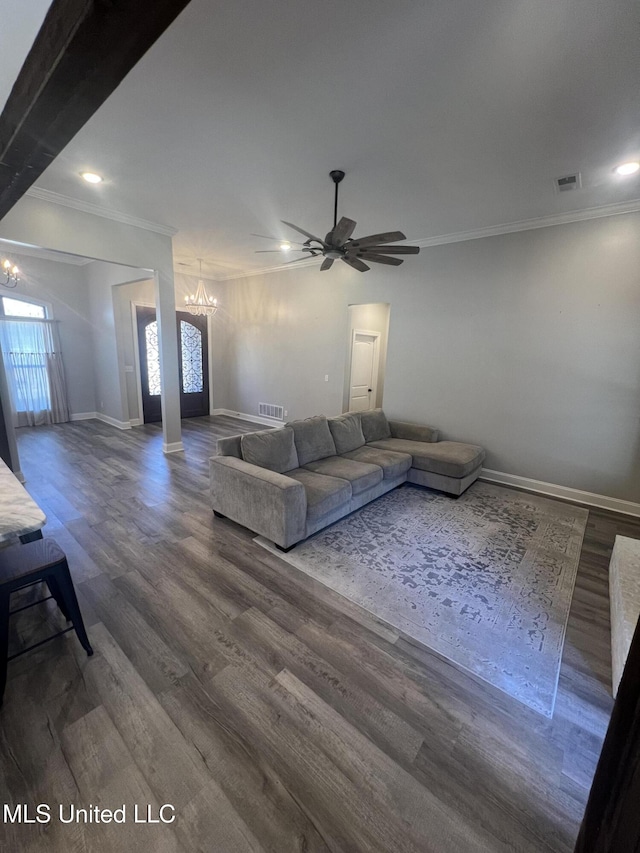 11368 Cedar Point Cv, Hernando, MS 38632 - unfurnished living room featuring crown molding, a chandelier, baseboards, ceiling fan, and dark wood-style floors