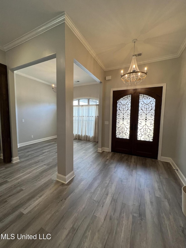 11368 Cedar Point Cv, Hernando, MS 38632 - foyer entrance featuring a chandelier, french doors, dark wood finished floors, crown molding, and baseboards